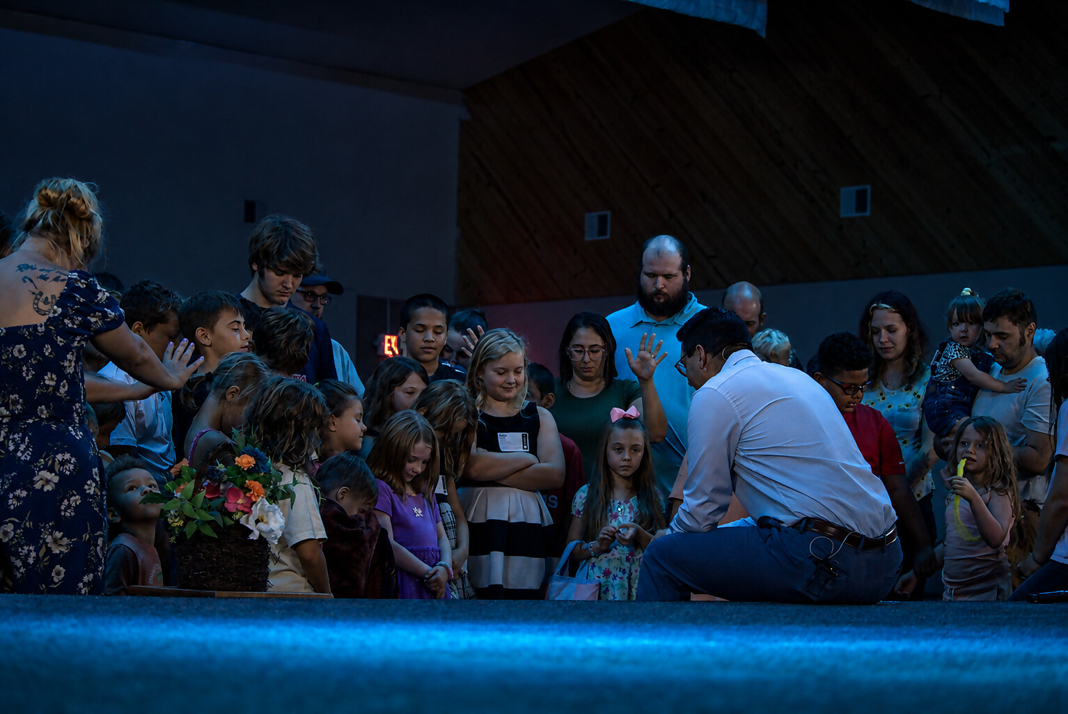 Praying over the children at the front of the sanctuary