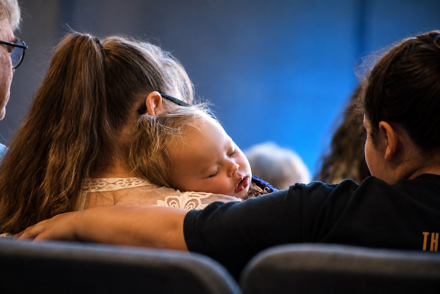 Friends gathered close in prayer and support