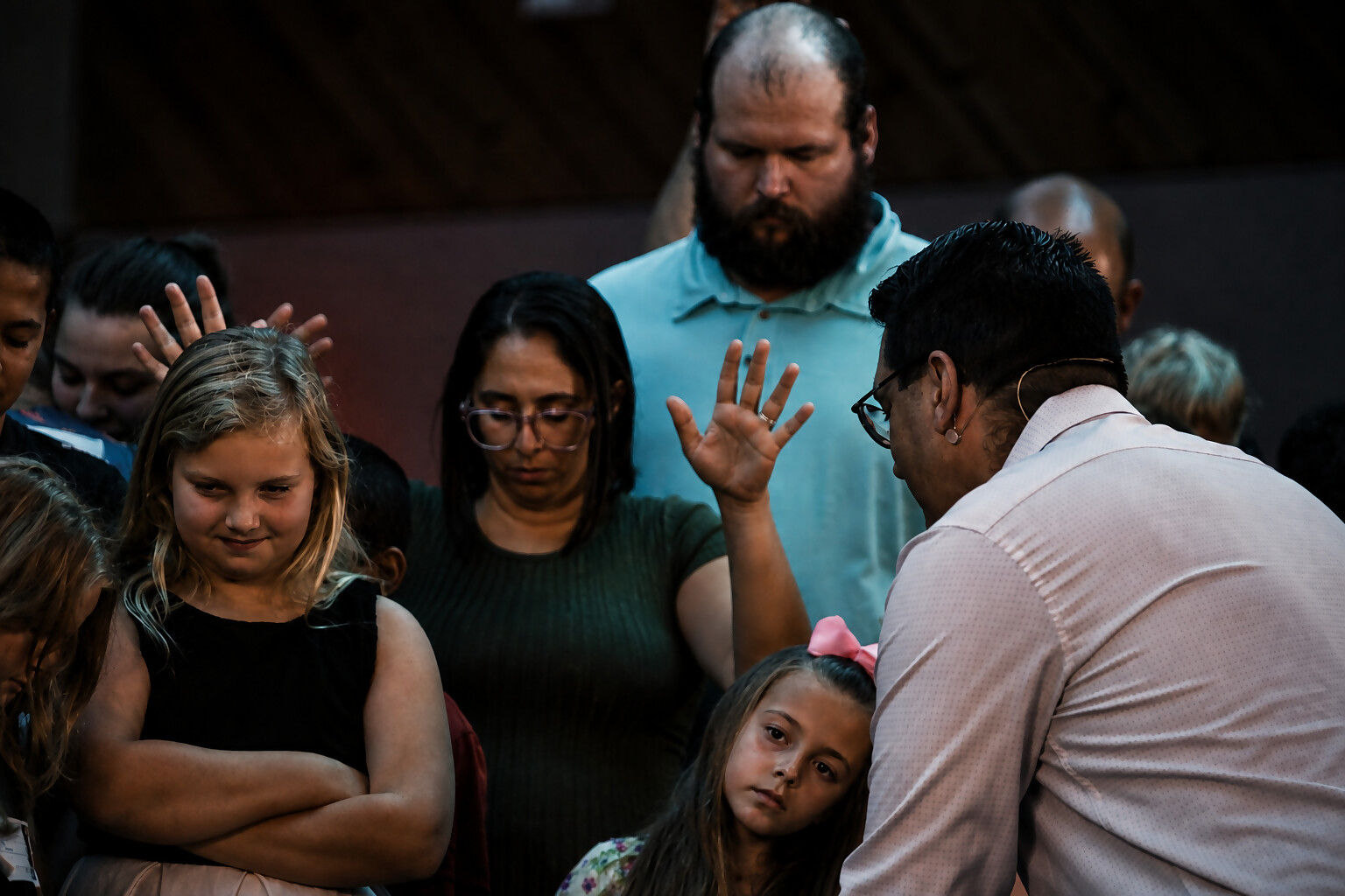 Arms around one another — a church family that stands with you